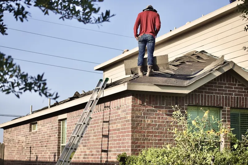 Professional roofer working on a residential roof in Bluestone